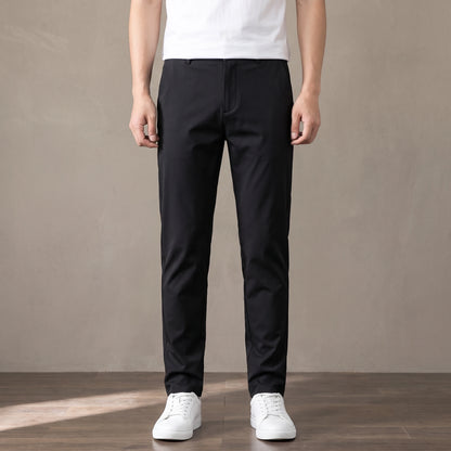 black tapered trousers worn with a white tee and white trainers