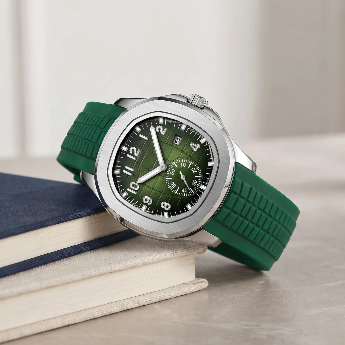 Green strap sport watch on a stack of books