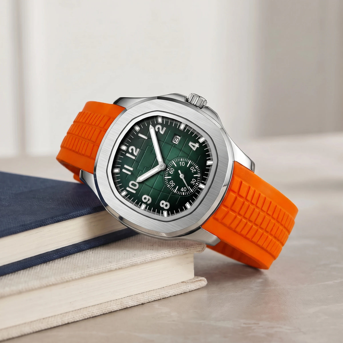 Orange strap sport watch on a stack of books